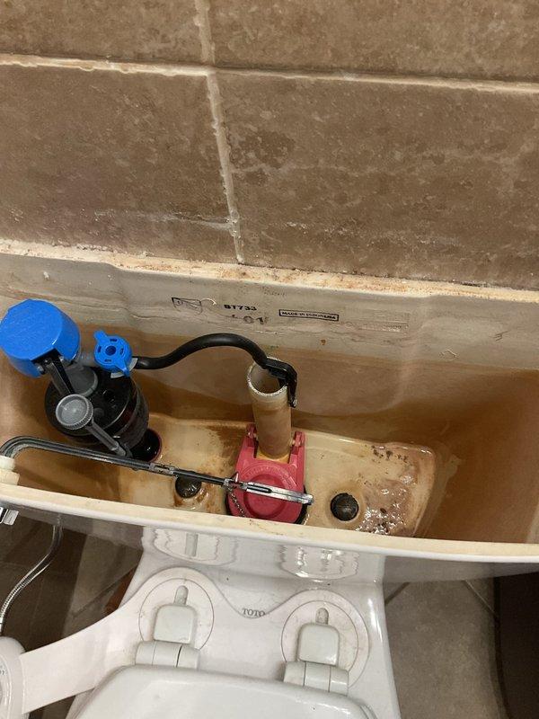 Responded to toilet leak causing water damage in basement. Upon inspection, determined toilet had shifted from original position, compromising wax ring seal at floor flange connection. Removed and reset toilet, installed new wax ring, and tightened closet bolts to proper torque specifications. Inspected tank components including fill valve, flush valve, and flapper assembly for proper operation. Verified all connections were secure and tested for leaks. Confirmed no further water seepage to basement level.