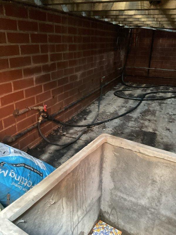 Responded to service call to inspect and pressure test gas line serving rooftop grill installation. Performed comprehensive visual inspection of gas piping system from basement/crawl space through building structure to roof deck termination point. Conducted pressure test on gas line to verify system integrity and ensure no leaks present in piping, fittings, or connections. System tested within acceptable parameters and confirmed safe for continued operation. Documented foundation and structural conditions observed during inspection access.