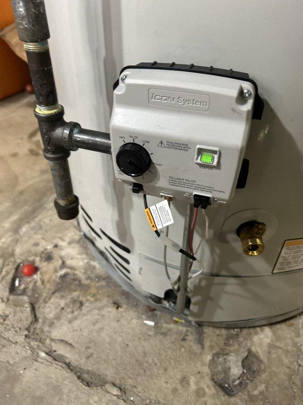 Installed new iCon System control unit for water heater with proper electrical connections and mounting. Replaced compressor or motor component with associated wiring (red, white, and black conductors) and verified all connections were secure and properly labeled.