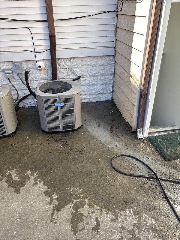 Responded to service call regarding potential water leak in mechanical room and on basement stairs following recent main line excavation work. Conducted thorough inspection of affected areas including exterior HVAC installation zone, interior stairwell, and basement mechanical room to determine if water intrusion was related to previous excavation and catch basin work. Documented conditions with photographic evidence showing concrete stairs with floor drain, HVAC equipment on exterior concrete pad, and areas of concern where water was reportedly observed.