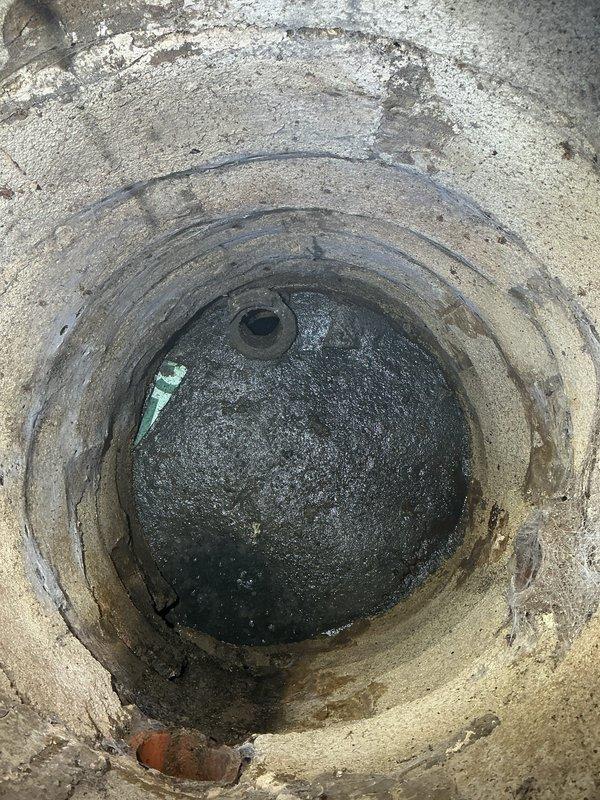 Completed main line sewer installation with new connection to existing drainage system. Installed large spherical distribution chamber within concrete vault structure, including necessary fittings and connections for proper flow management. System requires final scheduling for inspection and project completion.