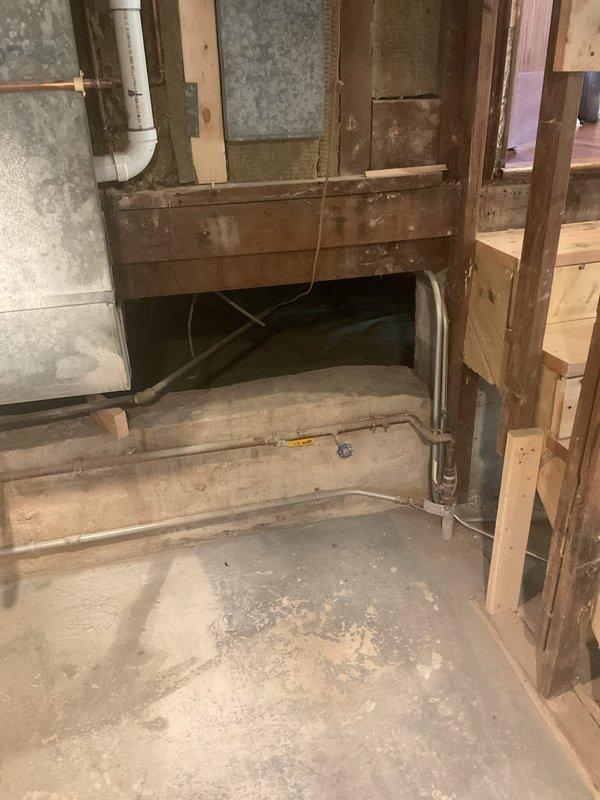 Conducted on-site assessment for whole home water treatment system installation in 80-year-old recently renovated residence. Evaluated basement main water line entry point and existing plumbing infrastructure, including aging utility connections, exposed piping systems, and available space for filtration, softening, and lead removal equipment installation. Documented current conditions of concrete foundation walls, structural framing, and utility routing to develop comprehensive installation plan for integrated water treatment system at point of entry.