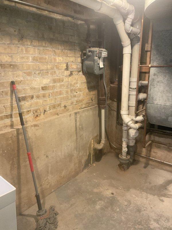 Conducted on-site assessment for whole home water treatment system installation in 80-year-old recently renovated residence. Evaluated basement main water line entry point and existing plumbing infrastructure, including aging utility connections, exposed piping systems, and available space for filtration, softening, and lead removal equipment installation. Documented current conditions of concrete foundation walls, structural framing, and utility routing to develop comprehensive installation plan for integrated water treatment system at point of entry.