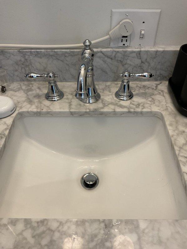 Responded to water leak complaint originating from second-floor bathtub usage and manifesting in basement ceiling area. Conducted thorough inspection of concealed plumbing systems within ceiling cavity, examining copper supply lines, drain assemblies, and surrounding structural components between floors. Located source of intermittent leaking in overhead plumbing infrastructure serving bathroom fixtures, with water bypassing first-floor areas and traveling directly to basement level through concealed pathways in floor joists and ceiling spaces.