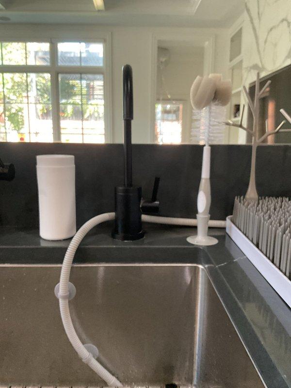 Responded to active water leak under kitchen sink that had been ongoing for approximately one week. Upon arrival, confirmed significant water discharge from supply line connection at brass fitting. Disassembled affected plumbing components, replaced faulty compression fitting and deteriorated supply line hose. Tested all connections under pressure, verified no additional leaks present, and confirmed proper water flow to fixtures. Cleaned moisture from cabinet interior and inspected surrounding areas for water damage.