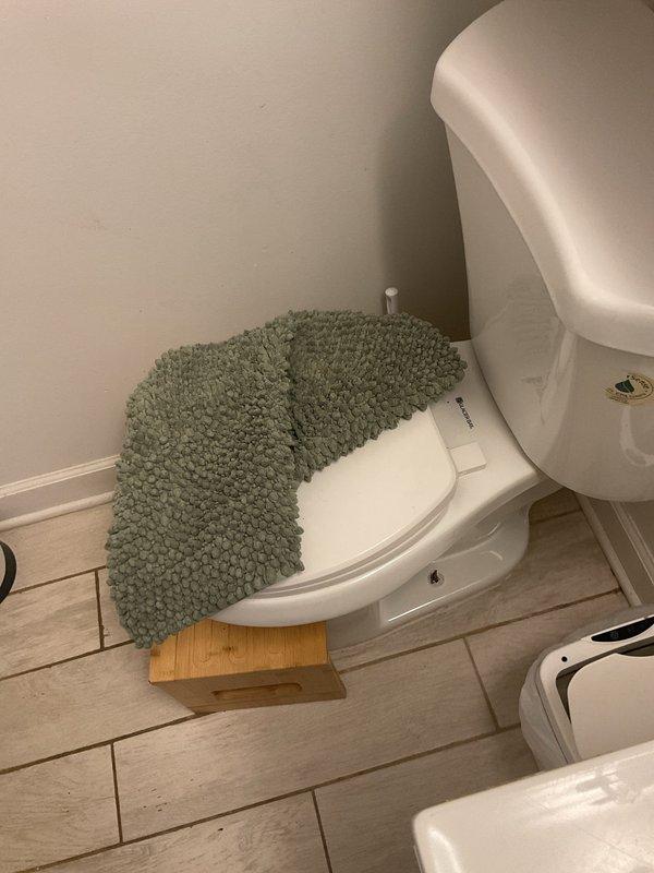 Responded to service call for shower drain backup and standing water issue. Upon arrival, found significant accumulation of hair and organic debris blocking the shower drain, preventing proper drainage. Removed debris buildup from drain opening and surrounding hexagonal tile floor area. Cleared obstruction to restore normal water flow through the drainage system. Verified proper drainage function upon completion of cleaning.