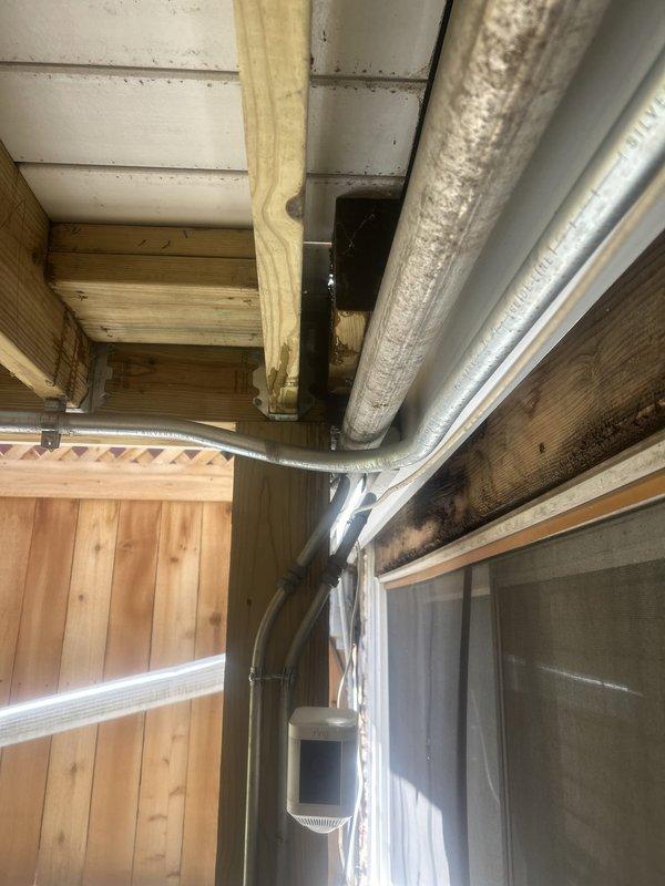 Responded to emergency call for water intrusion from unknown source in basement utility area. Upon inspection, identified active leak originating from compromised pipe connection near foundation window well. Isolated water supply to affected section and performed temporary shutoff to prevent further water damage to exposed wooden framing and structural elements. Traced moisture infiltration along HVAC ductwork pathway and basement window framing where discoloration on horizontal beams indicated prolonged exposure. Repaired burst section of piping, replaced damaged fittings, and restored water flow to system. Verified all connections for proper seal and tested system under full pressure to confirm repair integrity with no additional leaks detected.