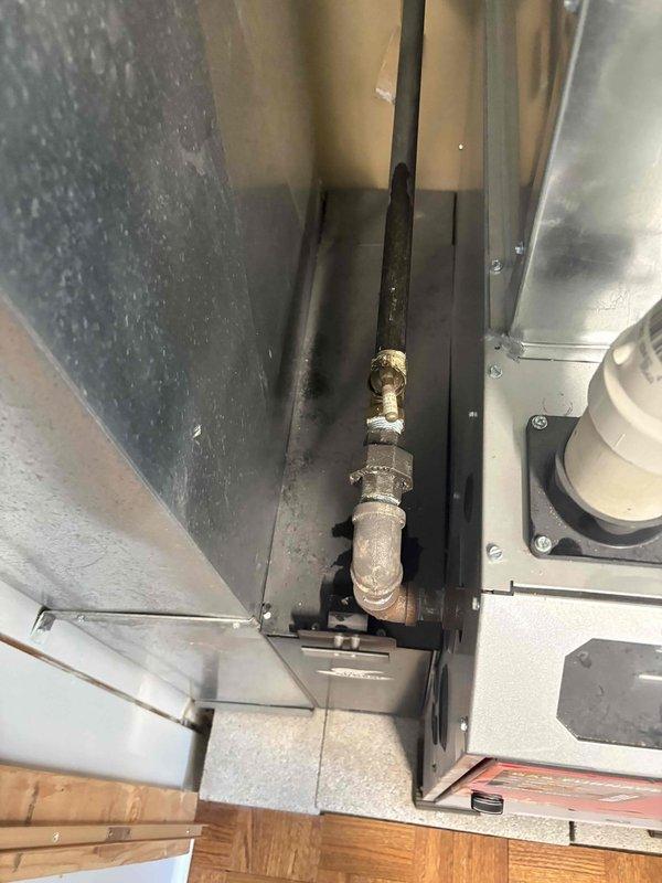 # Plumbing Inspection and Deficiency Assessment

Conducted a comprehensive plumbing system inspection identifying multiple code compliance issues and safety concerns requiring corrective action.

## Crawlspace Drainage System

Inspected condensate drainage connections in the crawlspace and identified a saddle drain tap installation. This connection method does not meet approved plumbing standards and presents significant risk for leakage or system failure. Documented the condition with photographs for repair planning.

Evaluated drain line support systems throughout the crawlspace. Found inadequate support using improvised materials including a five-gallon bucket and PVC sections serving as hangers. These non-compliant supports fail to meet building code requirements and may cause improper drainage slope, stress on pipe connections, and potential system failure. Proper approved hangers are required for code compliance.

## Water Heater System Evaluation

Examined the water heater insta