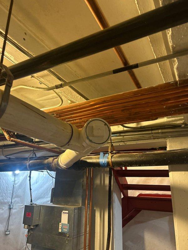 Completed comprehensive plumbing system upgrade including lead testing and hydrojetting services. Installed new copper piping throughout basement mechanical space with proper bundling and routing, coordinating with existing HVAC ductwork and electrical systems. Protected work area with drop cloths during installation and documented all work with photographs for quality assurance records.