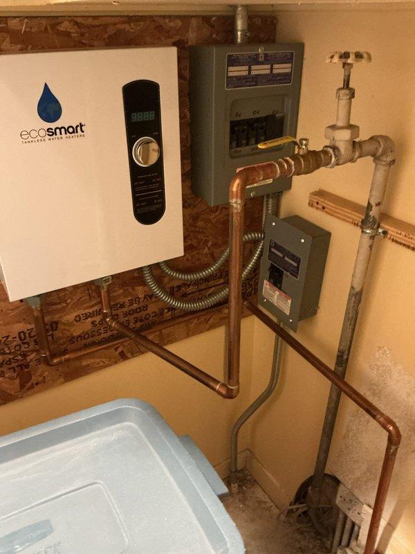 Performed maintenance flush on Ecosmart tankless water heater unit that had not been serviced since its 2024 installation. Connected flush pump system with hoses to the unit's isolation valves and circulated descaling solution through the heat exchanger to remove mineral buildup and maintain optimal performance. Successfully completed the flush procedure, restoring proper flow rates and ensuring continued efficient operation of the tankless system.