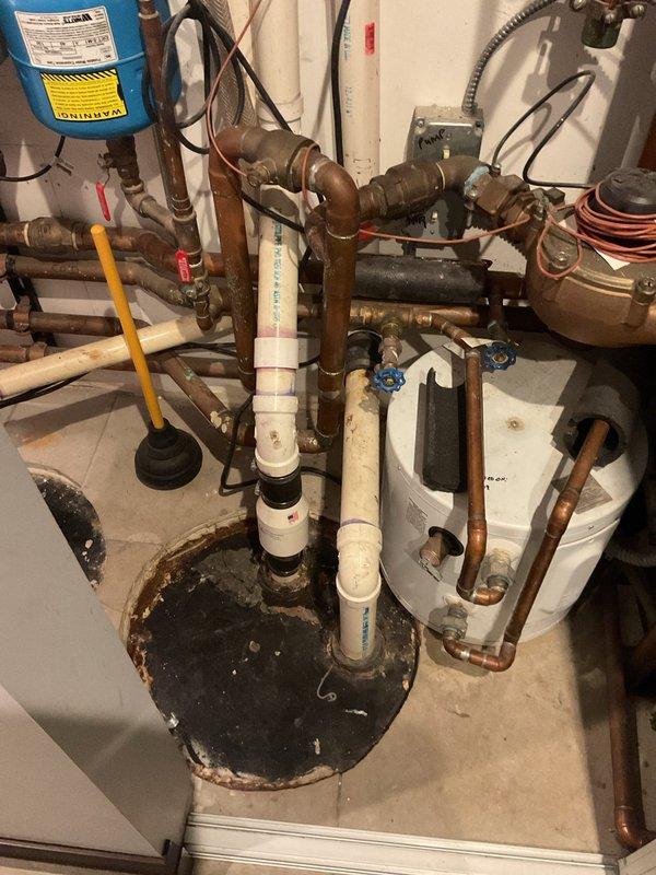 Installed new garbage disposal unit in kitchen sink. Provided customer with educational materials regarding proper disposal usage, including guidelines for acceptable food waste items and materials to avoid such as oils, grease, and non-food items. Inspected existing plumbing connections in utility area including water heater installation, copper supply lines, PVC drainage system, and associated shut-off valves to ensure proper integration with new disposal unit. All connections verified for proper operation and customer educated on maintenance requirements.