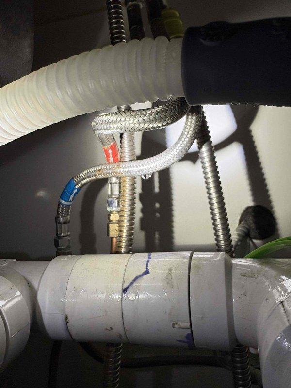 Performed comprehensive plumbing maintenance inspection on 80-year-old residential property. Conducted thorough examination of all accessible plumbing systems, fixtures, and components throughout the home.

Inspected water heater installation, verifying proper mounting hardware, support brackets, and insulation integrity. Examined flexible gas connectors and supply lines for signs of wear, corrosion, or deterioration. Confirmed secure connections and proper clearances within mechanical cabinet.

Evaluated under-sink plumbing configurations, including PVC drainage systems, P-traps, and waste lines. Inspected hot and cold water supply lines with braided stainless steel flex connectors, noting proper color-coded identification clips. Examined all visible pipe connections, fittings, and joints for leaks or potential failure points. Verified drainage hose and vent connections for proper installation and function.

Tested water pressure at multiple fixtures throughout the property. Checked a