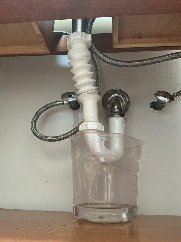 Responded to client request for same-day service and successfully replaced kitchen sink angle stops and P-trap assembly. Removed old fixtures and installed new brass angle stops with braided stainless steel supply lines, along with a complete white PVC P-trap configuration. All connections were tested for proper drainage and leaks, with system functioning correctly upon completion.