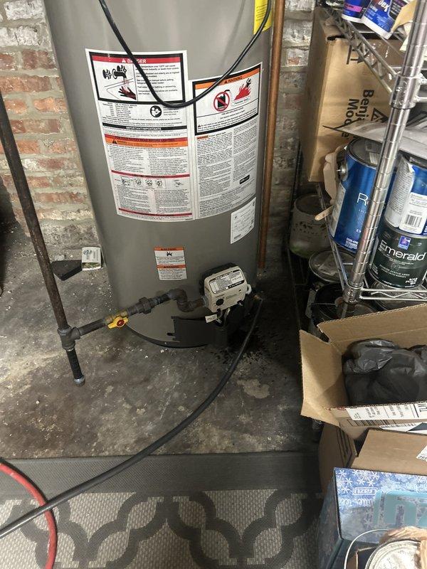 Completed routine VIP plumbing maintenance including comprehensive water heater flush on gas-fired unit located in historic home basement with exposed brick foundation and aging plumbing infrastructure. Inspected water heater connections, piping, and safety systems; verified proper operation of temperature and pressure relief valve; flushed sediment buildup from tank to maintain efficiency and extend equipment lifespan.
