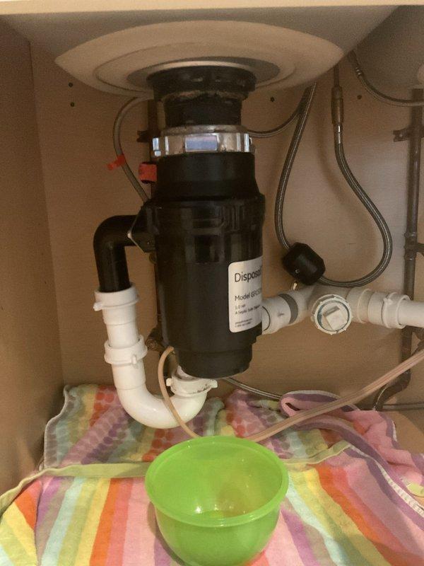 Installed new Badger 5 1/2 HP garbage disposal unit under kitchen sink. Completed all mounting hardware connections, electrical wiring with standard plug, and PVC drain plumbing with proper trap configuration to ensure code-compliant operation.