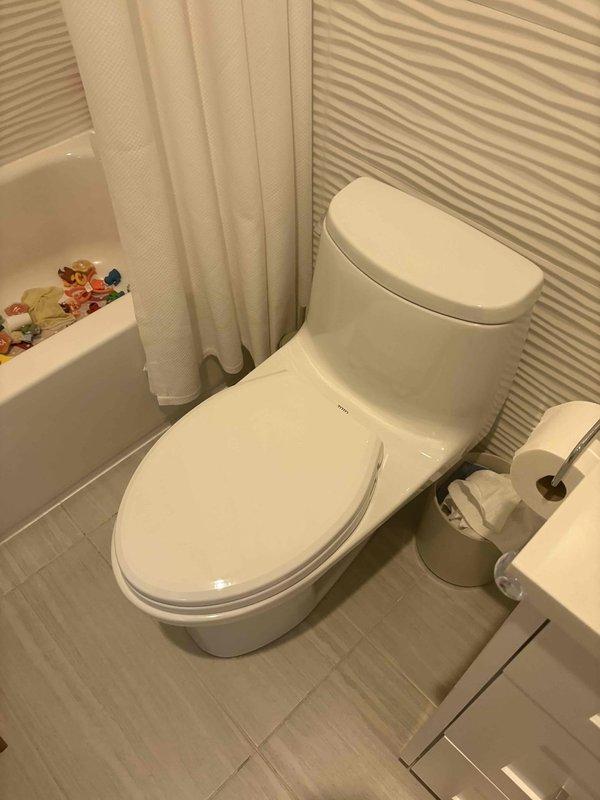 Responded to service call for sewer odors in first-floor powder room and water leak from second-floor toilet causing ceiling damage below. Upon inspection, identified water staining on flooring adjacent to toilet base and confirmed improper seal as source of both issues. Removed both affected standard gravity toilets and conducted thorough flange inspection and cleaning. Replaced wax seals with new wax/putty rings, installed new closet bolts, and properly reset both toilets to manufacturer specifications. Verified proper seating and seal integrity upon completion. All work covered under lifetime workmanship warranty.