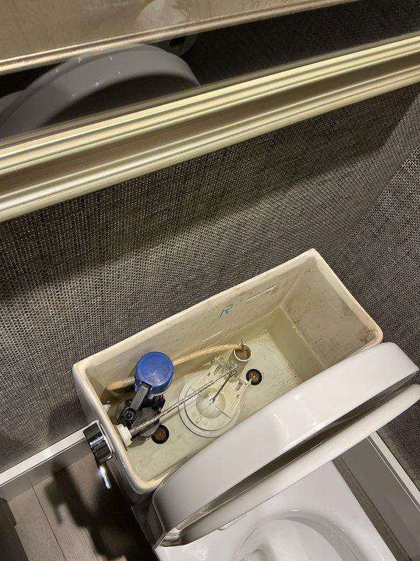 Responded to service call for clogged toilet in residential bathroom. Upon inspection, removed tank lid to assess internal components and flushing mechanism. Cleared obstruction and restored proper toilet function, verifying complete drainage and refill cycle operation before completing service.