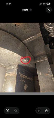 Responded to water leak complaint and conducted thorough inspection of the property. Investigation revealed moisture intrusion in the HVAC ductwork system, with specific area of concern identified and documented in the plenum where multiple duct sections converge. Additionally, discovered evidence of water damage and debris accumulation in basement corner area where walls meet flooring, indicating possible ongoing moisture issues. Documented findings with photographic evidence for further assessment and repair recommendations.