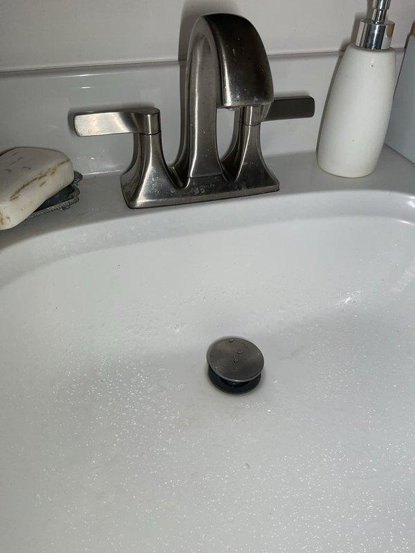 # Drain and Sewer Service Completed

Responded to service call for odor emanating from bathroom sink and slow drainage in basement shower. Upon arrival, performed thorough inspection of bathroom plumbing fixtures and drainage system. 

Investigated the bathroom sink to identify source of foul odor. Examined P-trap and drain assembly for potential blockages, biofilm buildup, or dry trap conditions that commonly cause sewer gas odors. Assessed the sink's drainage performance and tested water flow through the system.

Proceeded to basement level to evaluate the slow-draining shower. Conducted drainage test to determine severity of blockage and identify location within the drain line. Utilized appropriate drain cleaning methods to clear obstruction from shower drain line, restoring proper flow rate.

Addressed underlying causes of both drainage issues, which appeared related to accumulated debris, soap scum, hair, and organic material within the drain lines. Cleared blockages using mechani