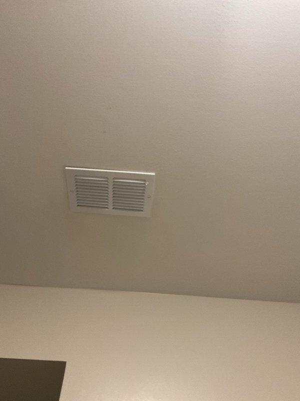 Responded to report of water leaking from basement ceiling below an upper-level A/C unit, with suspected clog in A/C condensate drain line. Performed camera inspection of plumbing and HVAC drain system to identify source of intermittent leaking that occurs during humid weather when air conditioning units are in heavy operation. Documented utility area conditions including water heater installations, PVC drainage piping, and ceiling-mounted HVAC vent locations to assess potential drainage pathway issues in the 20-year-old residential system.