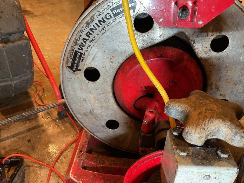 Responded to a basement drain backup in a 71-year-old residential property. Upon arrival, performed visual inspection of the drainage system and identified blockage in the main basement floor drain line. Utilized pipe threading and cleaning equipment to access and clear the obstruction in the aging cast iron drain system. Removed accumulated debris and sediment buildup that had developed in the drainage pipes over time. Tested water flow following clearance to confirm proper drainage function and verified no additional backup issues. System restored to normal operation with water flowing freely through the basement drain.
