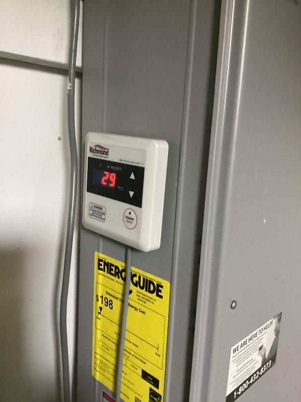 Responded to service call for Richmond Encore series water heater displaying error code and audible beeping alarm. Performed diagnostic inspection of unit and digital controller panel showing 29°C temperature reading. Documented equipment condition and controller display for estimate preparation. Provided commercial drain and sewer estimate for proceeding with necessary repairs to resolve error code condition and restore proper water heater operation.