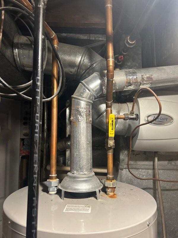 Responded to service call for Bradford White 50-gallon natural gas water heater with pilot light failure in basement of century home. Upon inspection, determined pilot would not ignite or remain lit, indicating likely thermocouple failure or gas control valve malfunction. Assessed unit age, condition, and safety compliance given the ongoing five-day outage affecting household hot water supply.