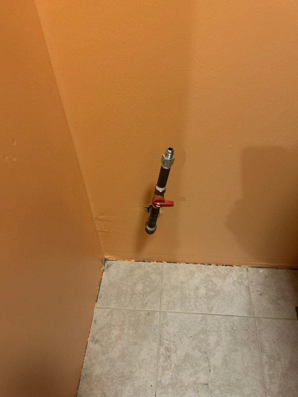 Responded to request for gas line modifications in residential property. Assessed two existing gas lines requiring shortening—one located in laundry room area and one in kitchen. Upon arrival, conducted visual inspection of gas meter assembly and associated copper piping at exterior of building, noting existing corrosion and oxidation on connections. Evaluated interior gas line routing in laundry room, identifying black-handled shutoff valve and existing copper supply line configuration. Provided detailed estimate for shortening both gas lines to customer specifications, including materials, labor, and code-compliant installation procedures to ensure proper gas flow and safety standards are maintained.