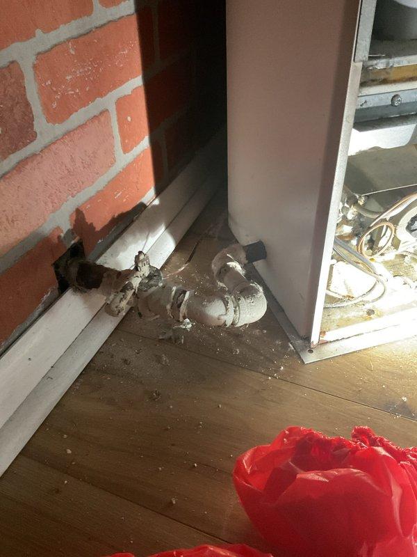 Responded to emergency gas odor call at residential property. Upon arrival, located gas smell near wall-mounted heating unit in corner room with exposed brick walls. Inspected heating equipment with open access panel and assessed gas valve operation. Conducted safety evaluation of gas piping system, tested for leaks, and verified proper gas pressure levels to ensure safe operation of heating appliances.