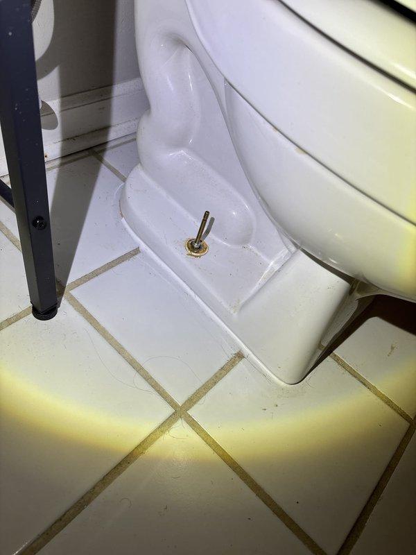 Responded to water leak originating from unit and affecting the unit below. Upon arrival, inspected jetted bathtub and surrounding bathroom fixtures to identify source of leak. Documented existing conditions including water damage and staining visible on wall tiles and ceiling surfaces near tub area. Examined toilet installation and floor mounting points for potential leak sources. Photographed affected areas showing standing water in jetted tub with active jet fixtures, deteriorated grout lines, and water-stained ceiling tiles indicating ongoing moisture intrusion. Coordinated authorization and provided assessment for necessary repairs to resolve inter-unit water leak issue.