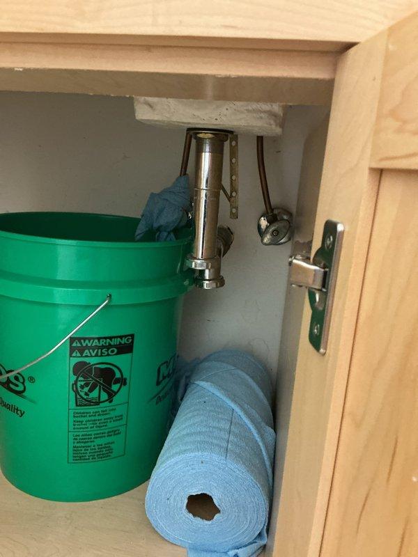 Responded to priority rescheduled service request for water leak repair and plumbing fixture replacement. Replaced shutoff valves under bathroom sink and kitchen sink to address leaking fixtures and ensure proper water control. Capped water line running to refrigerator as requested. Identified non-compliant PVC drain lines under kitchen sink, which violate building code requirements for structures exceeding five stories in height, and documented for future remediation. All accessible shutoff valves now operational and leak-free.