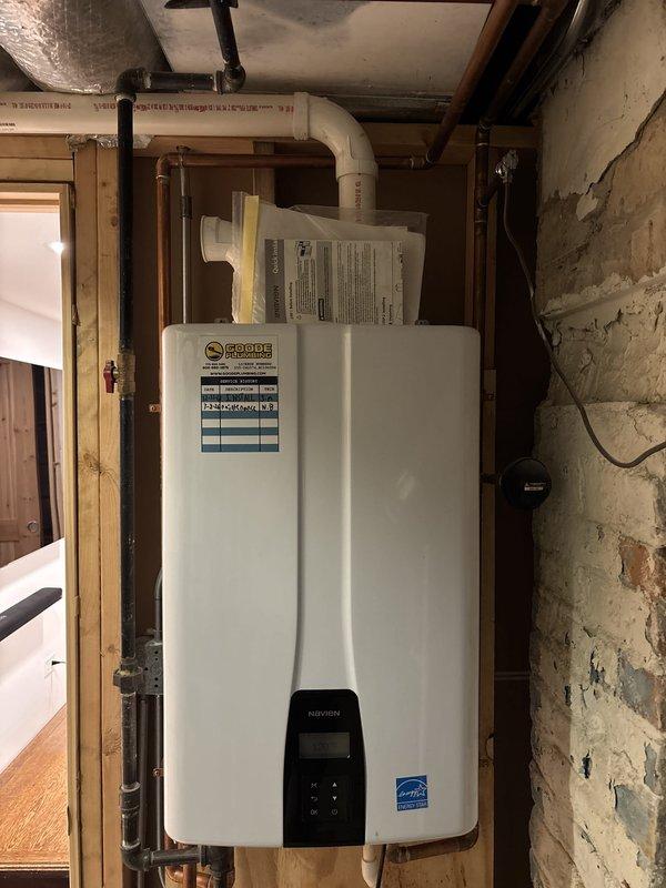 Responded to service call for Navien tankless water heater displaying red error code indicating PCB malfunction. Upon inspection, removed and cleaned inlet filter screen which had accumulated debris, potentially causing flow restriction and triggering false error code. Verified all electrical connections to printed circuit board were secure, tested unit operation, and confirmed system returned to normal function with error code cleared and hot water delivery restored.