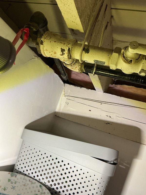 Responded to emergency gas leak call and conducted comprehensive inspection of gas line system. Located leak on deteriorated yellow-painted gas pipe in basement utility area showing significant wear and paint deterioration. Performed pressure test to verify leak location and assess system integrity. Repaired compromised section of gas line and replaced worn connections. Conducted post-repair pressure test to confirm proper seal and system safety, verifying all connections meet code requirements and operate within acceptable pressure parameters.
