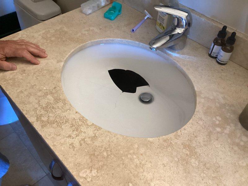 Measured existing bathroom vanity sink for replacement fixture, documenting internal basin dimensions of 15 3/4" x 12 3/4" and overall countertop cutout of 19" x 13". Parts have been ordered (model LT597) and are available for installation; scheduling follow-up appointment to complete fixture replacement.