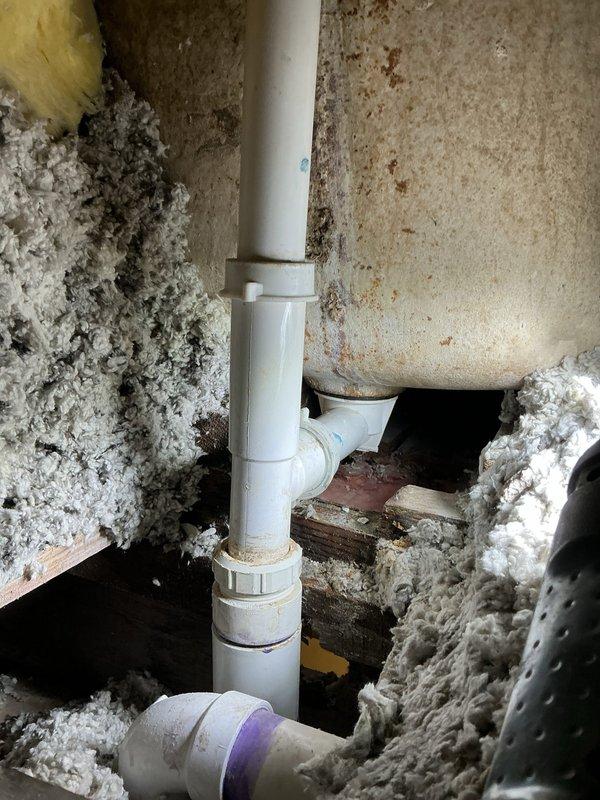 Responded to a severely clogged bathtub/shower drain with water leaking into the basement below the fixture. Successfully cleared the main drain line obstruction and inspected the plumbing assembly in the basement crawl space, identifying the PVC drainage system routing from the bathroom fixture. Verified proper drainage flow through the tub drain and overflow assembly, eliminated the basement drip leak, and confirmed all connections were secure with no further water intrusion observed after testing.