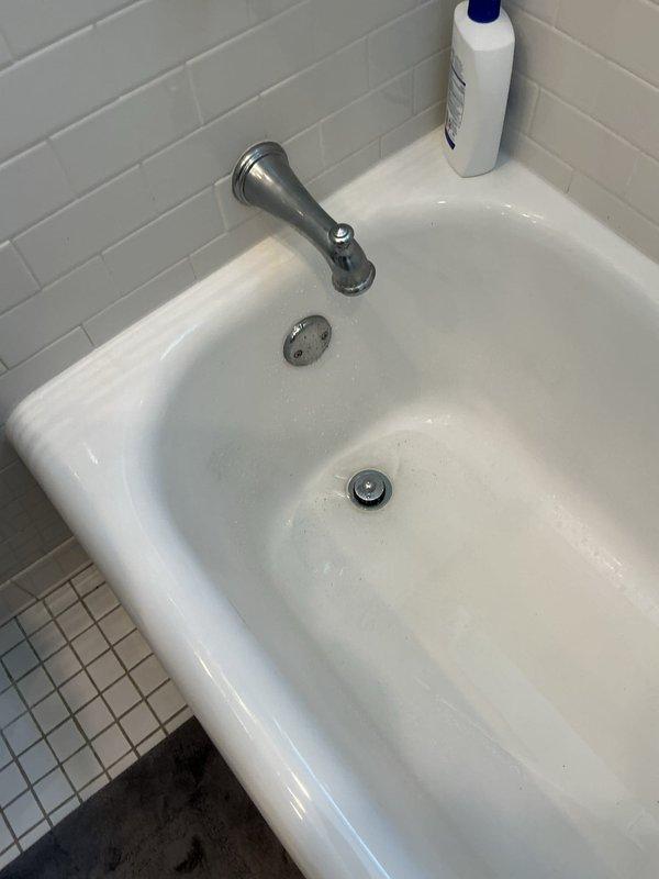 Responded to a severely clogged bathtub/shower drain with water leaking into the basement below the fixture. Successfully cleared the main drain line obstruction and inspected the plumbing assembly in the basement crawl space, identifying the PVC drainage system routing from the bathroom fixture. Verified proper drainage flow through the tub drain and overflow assembly, eliminated the basement drip leak, and confirmed all connections were secure with no further water intrusion observed after testing.