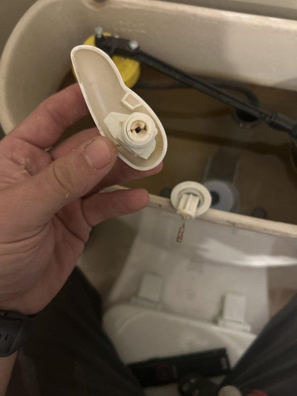 Responded to service call for malfunctioning toilet with broken handle mechanism. Upon inspection, diagnosed failed flush valve flapper and associated linkage components within the tank. Removed defective white plastic flush valve assembly and stopper mechanism that had deteriorated, preventing proper flushing operation. Replaced faulty components with new flush valve flapper and reinstalled hardware to restore full functionality. Tested flush mechanism multiple times to ensure proper operation and water seal. Toilet now operates normally with handle engaging flush valve correctly.