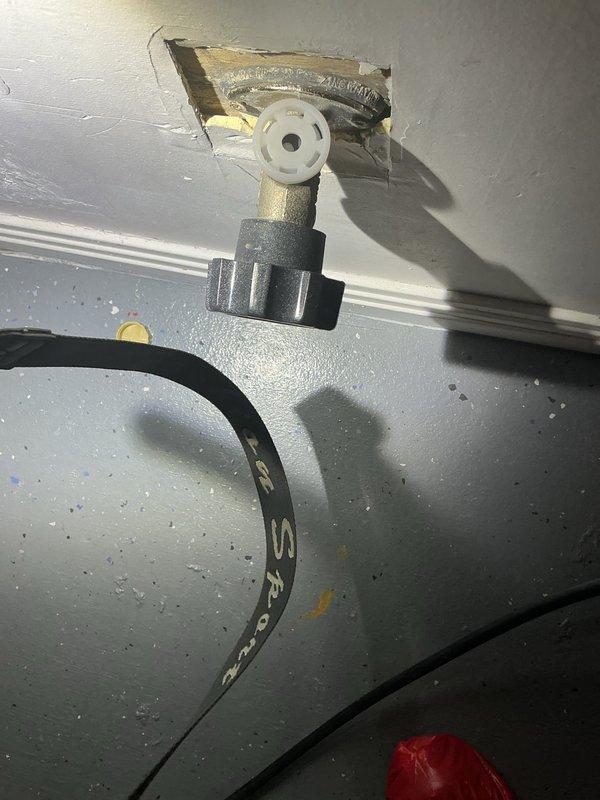 Responded to a priority rescheduled plumbing repair call and successfully completed the sold repair work. Addressed issues with a metal shut-off valve protruding from the wall, which exhibited significant damage to the surrounding drywall material at the mounting point. Additionally, serviced a plumbing penetration point through the ceiling near HVAC ductwork, where a white plastic component with mounting hardware required attention due to rough edges and residue accumulation around the opening.