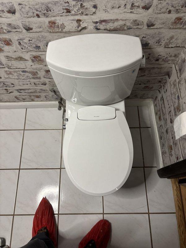 Replaced existing toilet with new fixture using wax ring seal to eliminate sewer gas leak. Removed old toilet, inspected flange for damage, installed new two-piece toilet with proper sealing to prevent future gas infiltration. Additionally performed tank water heater flush service on unit purchased in 2020 that had never been maintained. Drained sediment buildup from tank, cleared discharge line, and refilled system to restore optimal performance and efficiency.