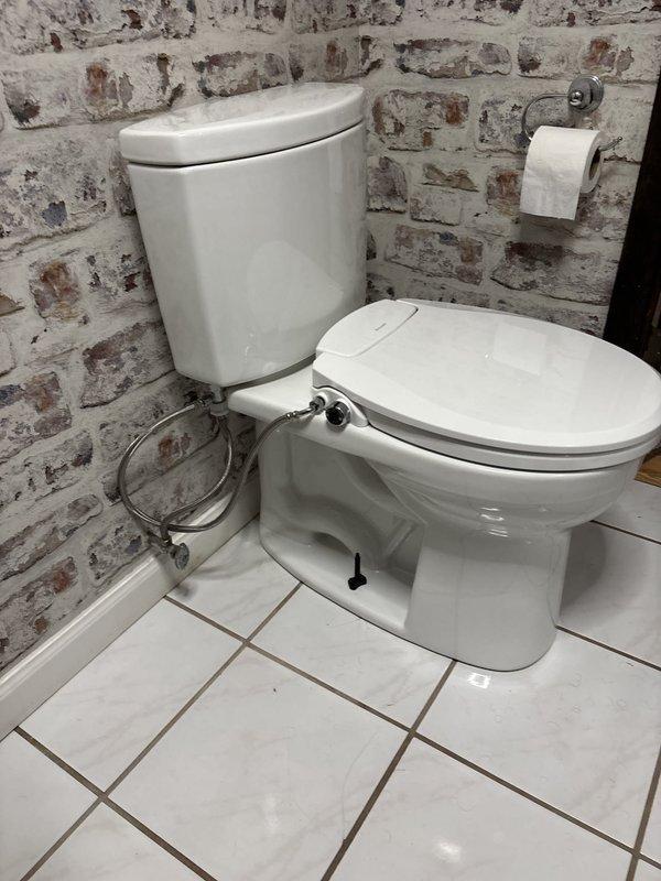 Replaced existing toilet with new fixture using wax ring seal to eliminate sewer gas leak. Removed old toilet, inspected flange for damage, installed new two-piece toilet with proper sealing to prevent future gas infiltration. Additionally performed tank water heater flush service on unit purchased in 2020 that had never been maintained. Drained sediment buildup from tank, cleared discharge line, and refilled system to restore optimal performance and efficiency.