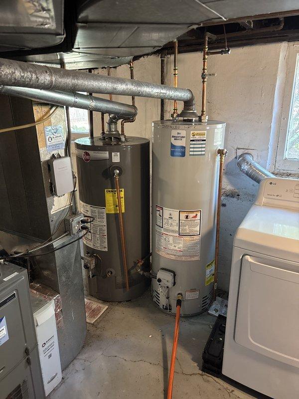 Completed comprehensive VIP maintenance service on residential water heater system in basement utility area. Performed thorough inspection of dual water heater installation, including dark gray and beige tank units, verified proper operation of all copper piping connections, brass valves, and safety relief components. Inspected and confirmed proper functioning of associated HVAC equipment, electrical panels, and mechanical systems in the utility space, with all equipment operating within manufacturer specifications and no issues identified.