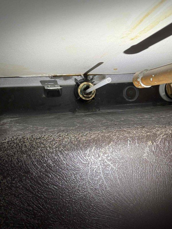 Responded to a water leak underneath the kitchen sink in a 20-year-old residential property. Upon arrival, performed a thorough inspection of the cabinet area and identified compromised plumbing connections beneath the sink. Accessed the affected piping system, which showed signs of deterioration consistent with the age of the home. Disassembled the drain assembly and supply line connections to assess the extent of the leak. Replaced worn washers, gaskets, and compression fittings on the water supply lines. Tightened all connections and reinstalled the drain trap assembly with new sealing components. Tested the system by running water through the faucet and monitoring all connection points for moisture. Confirmed no active leaks were present and verified proper drainage. Cleaned the work area and advised the homeowner on routine maintenance to prevent future issues.