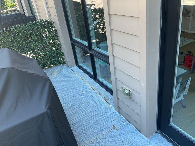 Completed plumbing service consultation and assessment at residential property with exterior balcony access. Conducted thorough visual inspection of outdoor living space to identify potential plumbing concerns and provided repair recommendations to customer. Documentation photos captured of service area for records.
