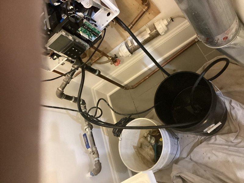 Completed annual preventive maintenance on tankless water heater system and basement sump pumps as part of club membership program. Performed comprehensive inspection of tankless unit including heat exchanger coils, electrical connections, wiring harness, and internal components—all found in proper working condition with no scaling or corrosion present. Tested and verified proper operation of basement pump systems, checked float switches, discharge lines, and electrical connections. Flushed and descaled water heater assembly, cleaned inlet filter screen, and verified proper gas combustion and venting. All equipment operating within manufacturer specifications with no issues identified or repairs required.