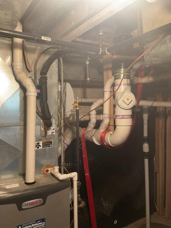 Performed comprehensive gas leak inspection and pressure test on residential gas system. Multiple gas leaks were identified throughout the system, requiring immediate shutdown of gas supply for safety. Documented all leak locations with photographs showing affected areas in mechanical room including connections near furnace, gas piping, and associated components.