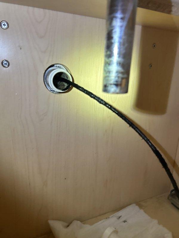 Responded to service call for slow draining bathroom sink and additional plumbing requests. Assessed and cleared drainage issue in bathroom sink to restore proper flow. Secured loose faucet at downstairs wet bar, tightening mounting hardware and connections. Installed customer-supplied rainfall showerhead in bathroom, ensuring proper mounting and testing water flow and pressure. Performed comprehensive inspection of all visible plumbing fixtures and connections throughout the property to verify proper operation and identify any potential concerns.