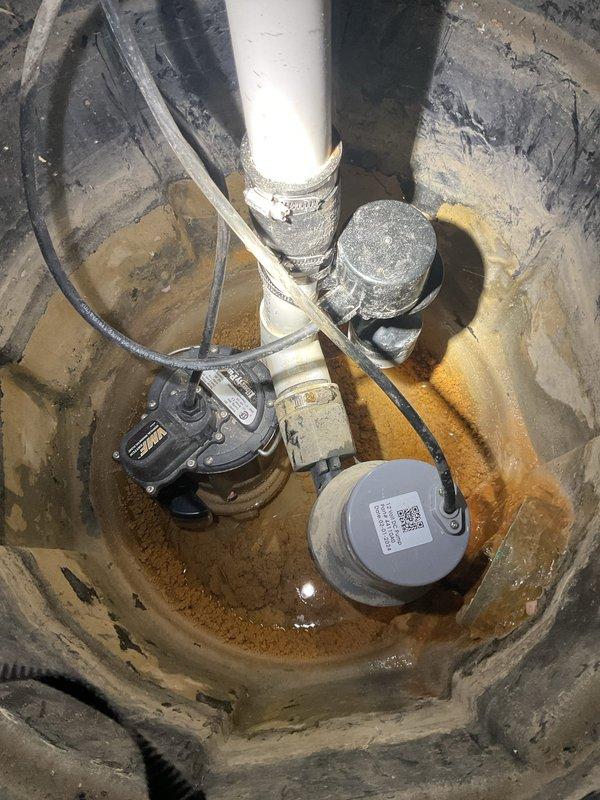 Responded to service call for sump pump making gargling noise with red power light on Liberty Pumps control panel. Upon inspection, discovered loose wire connection at the control unit in confined utility space. Reconnected and secured the detached wire to restore proper electrical connection between the pump system and control panel. Verified pump operation, checked sump pit for proper water level and discharge function, and confirmed all indicator lights returned to normal status. System tested and restored to full working condition.