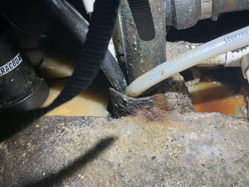 Completed toilet replacement in residential property. Removed existing corroded toilet with deteriorated plumbing connections showing significant rust and mineral buildup. Addressed water leakage issue at supply line connection point. New toilet was procured and installation scheduled with client. Work area showed evidence of long-term moisture exposure requiring assessment of surrounding plumbing infrastructure in utility room area where HVAC and mechanical systems are housed.