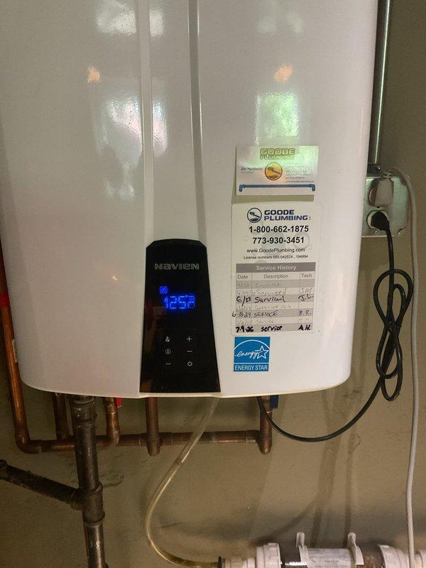Performed routine maintenance flush on Navien tankless water heater located in basement. Unit was operating properly with display reading 125°F. Removed and cleaned flow sensor to ensure optimal performance and prevent scale buildup. Flushed system with descaling solution through copper supply lines, verified all connections, and confirmed proper operation upon completion. Unit returned to service in excellent working condition.