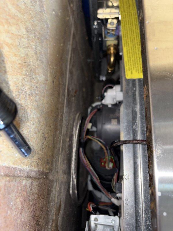 Responded to emergency call for water backing up through basement floor near recent sewer line replacement in century-old home. Upon arrival, accessed main drain cleanout and performed thorough cable cleaning of main sewer line to remove blockage causing backup. Cleared obstruction and verified proper drainage flow restored. Documented mechanical equipment area and affected basement space with photos showing system configuration and work area conditions.